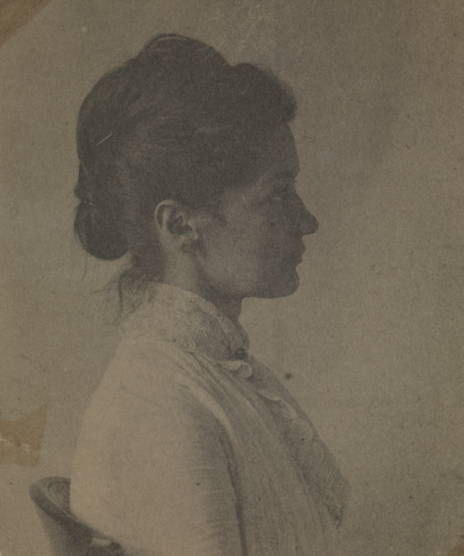 Mary Macdowell in light dress, sitting, facing right