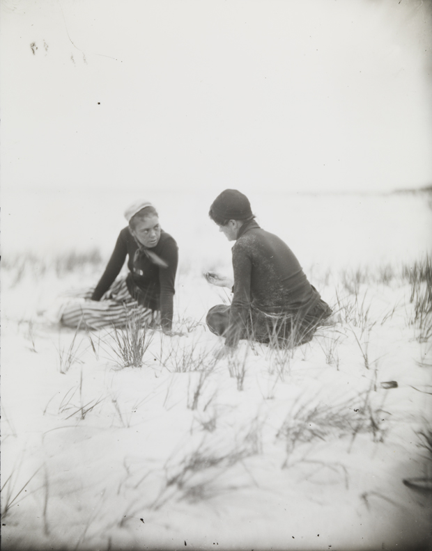 Margaret Eakins and Elizabeth Macdowell sitting in beach grass at Manasquan, New Jersy (?)