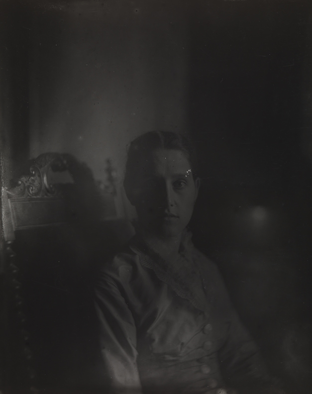 Margaret Harrison sitting in carved armchair