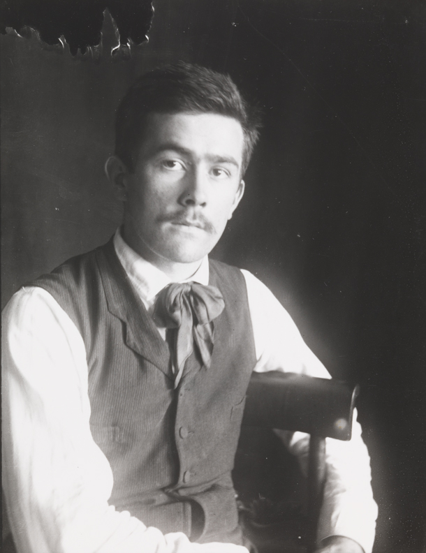 Samuel Murray sitting, looking left