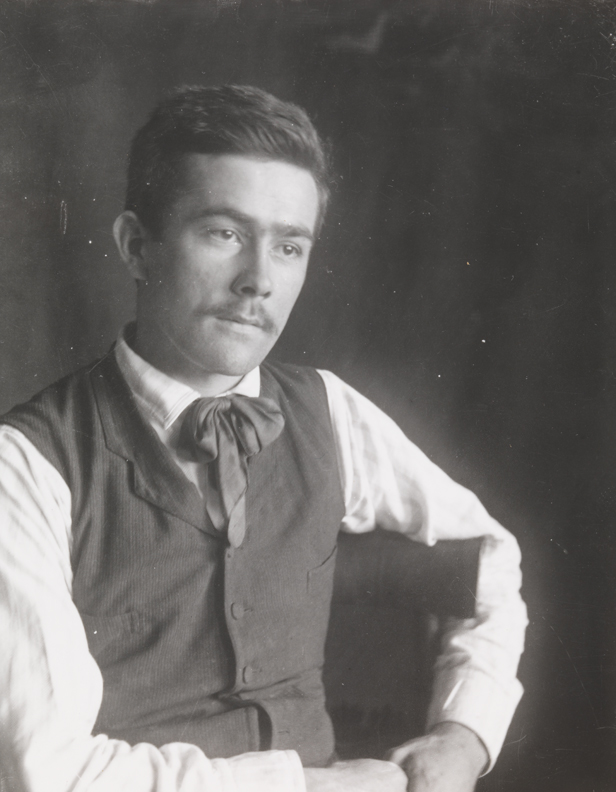 Samuel Murray sitting, looking right