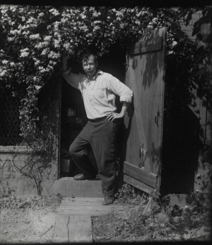Charles Bregler in doorway of shed