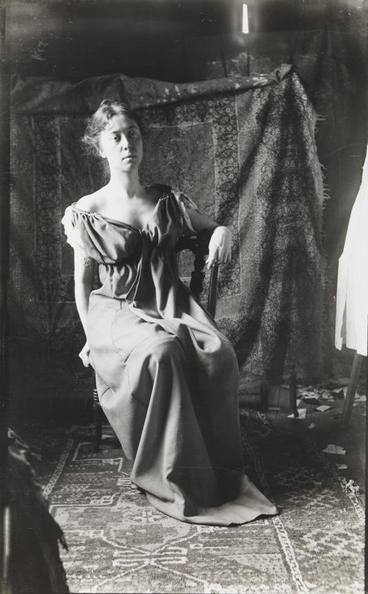 Clara Mather sitting in lyre-back chair