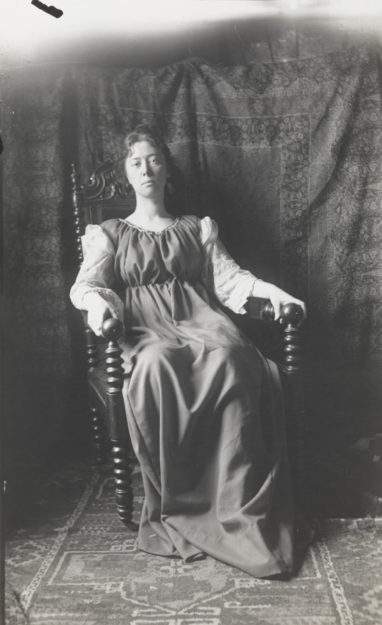 Clara Mather sitting in carved armchair