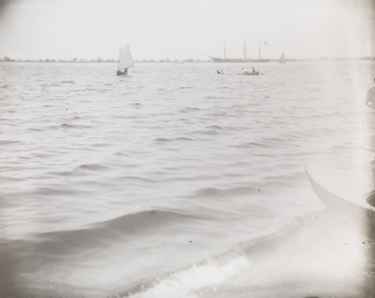 Delaware River with small sailboat on starboard tack