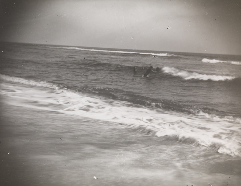 Beach with two swimmers at Manasquan, New Jersey