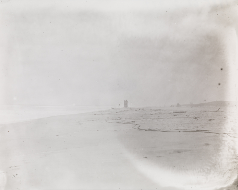 Beach in fog, with figures in distance, at Manasquan, New Jersey