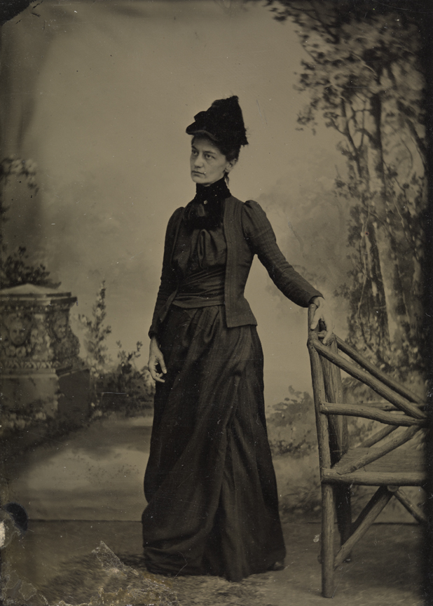 Mary Macdowell in front of painted backdrop