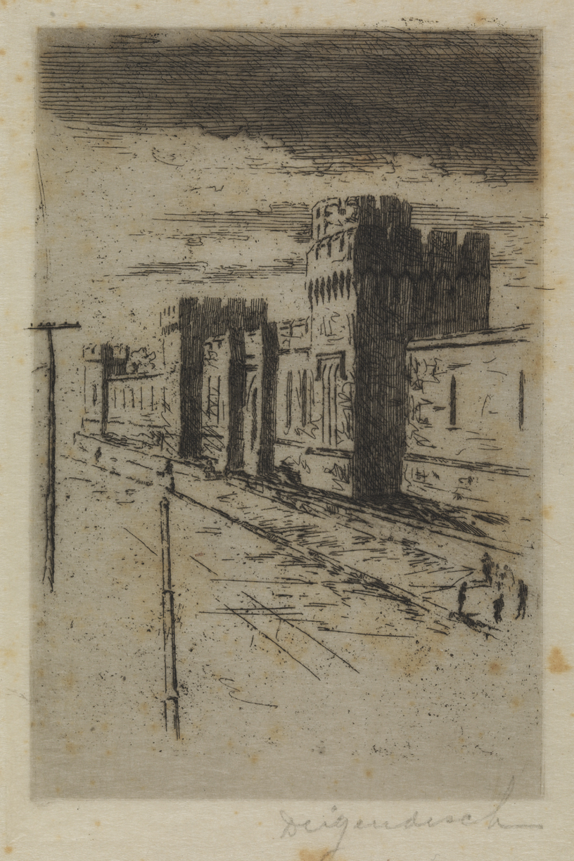 View of Fortress-like Building Alongside Railroad Tracks