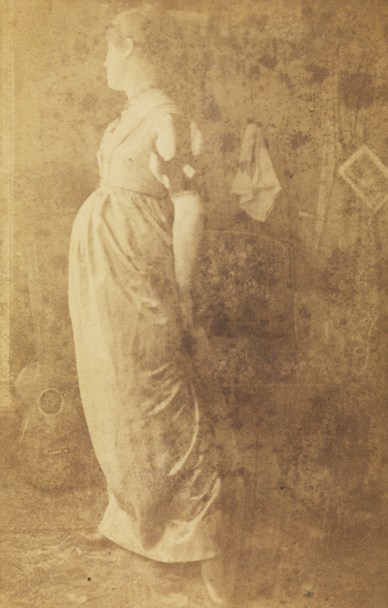 Woman in dress with slashed sleeves