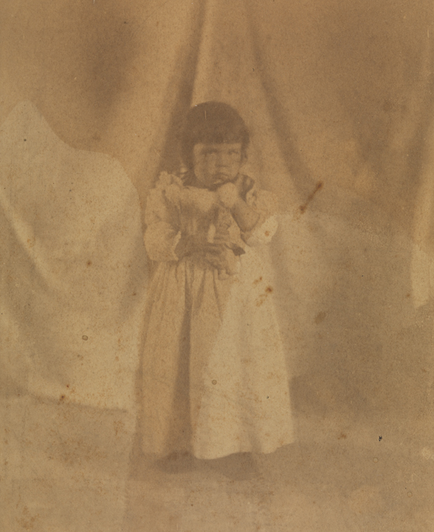 Marian Willoughby (standing, holding doll to her chest)