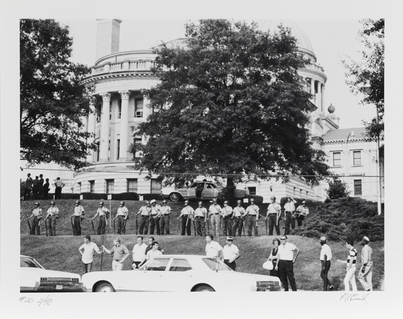 A police guard welcomes us but they stop no one.