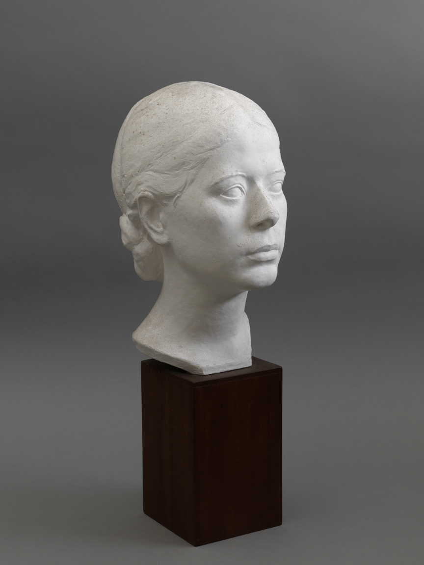 (Woman with hair in a bun)