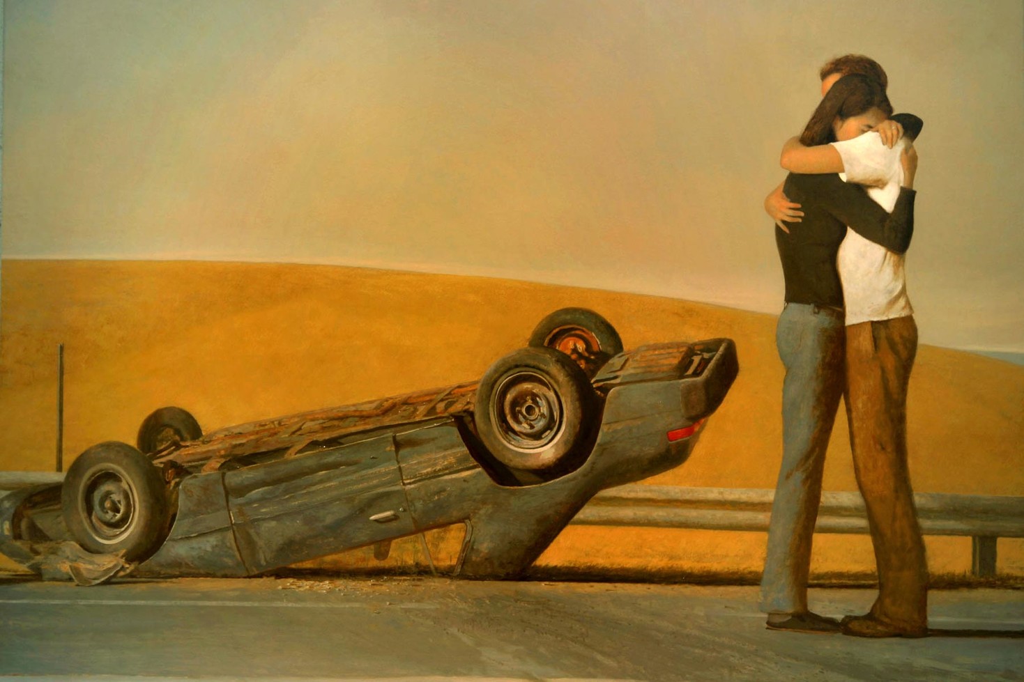 A flipped car rests on a deserted road. Nearby, two people embrace tightly, conveying relief and concern against a backdrop of rolling hills under a muted sky.