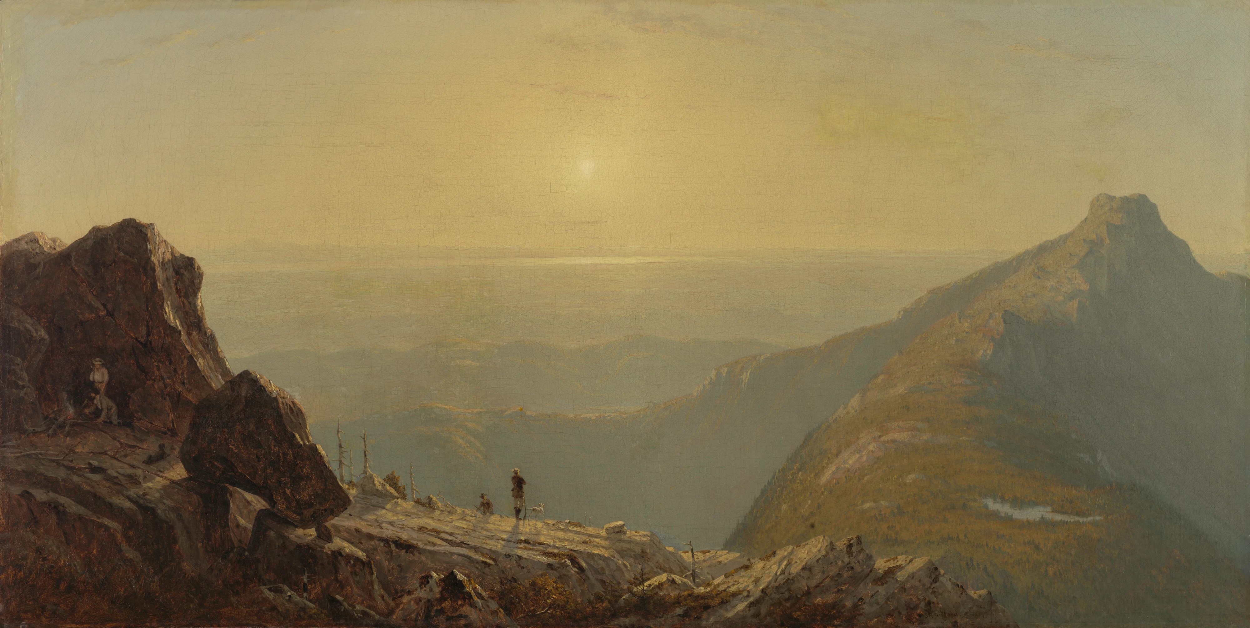A group of travelers and dogs stand on a rocky mountain ledge, gazing at a vast, softly lit valley below. The scene evokes tranquility and wonder.