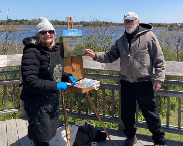 Student and instructor with outdoor painting easel
