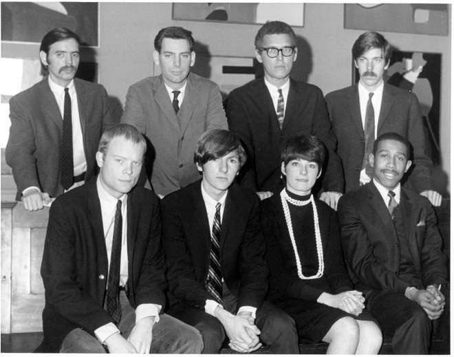 A black and white photograph of either people, all men except for Barbara Sosson.