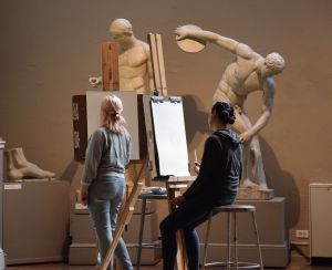 Two students drawing in the Cast Hall