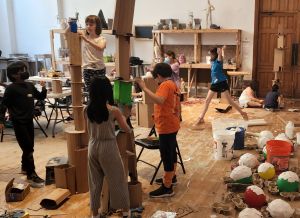 Children building sculpture together