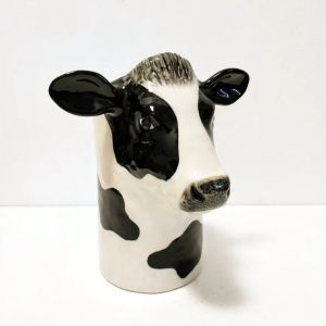 Ceramic Utensil Holder that looks like a cow.