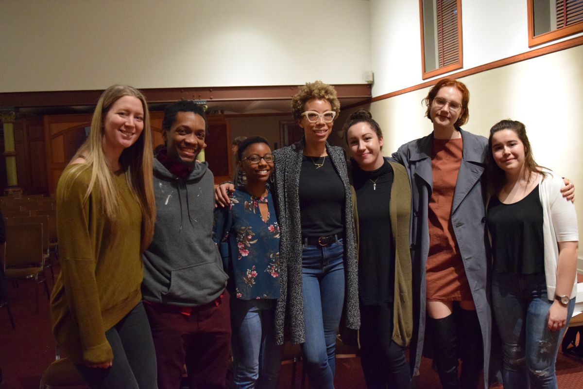 Amy Sherald (center) meets with students after the Visiting Artists Program lecture.