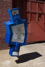 Jordan Griska, Honor Box, 2011, two steel newspaper boxes, digitally rendered newspaper pages, 50 x 22 x 16 in.