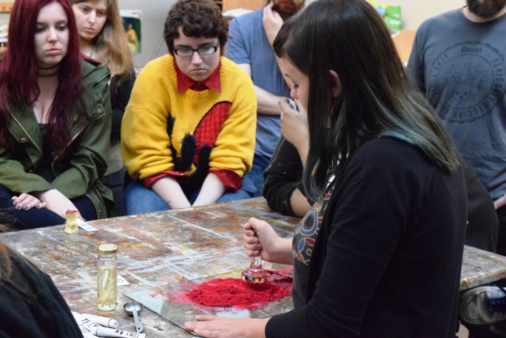 Liza Samuel makes paint on a table