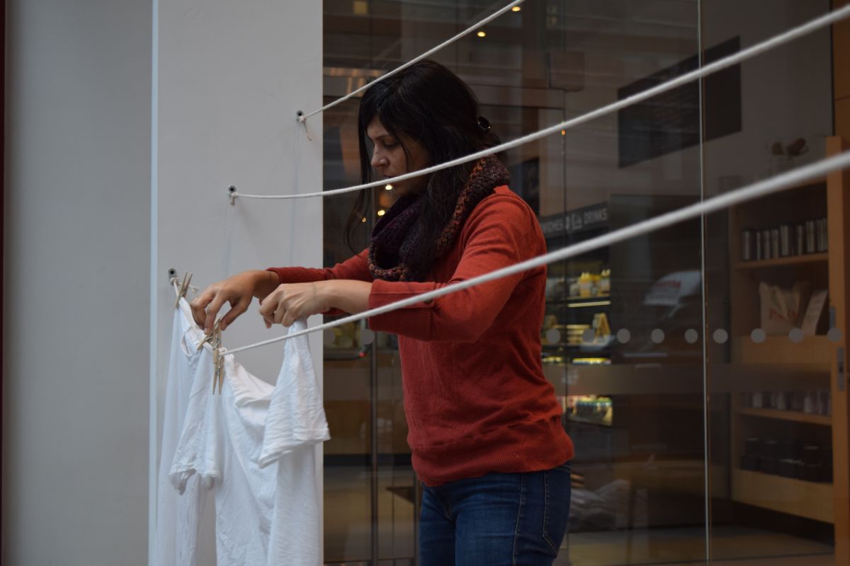 woman hanging wash to dry