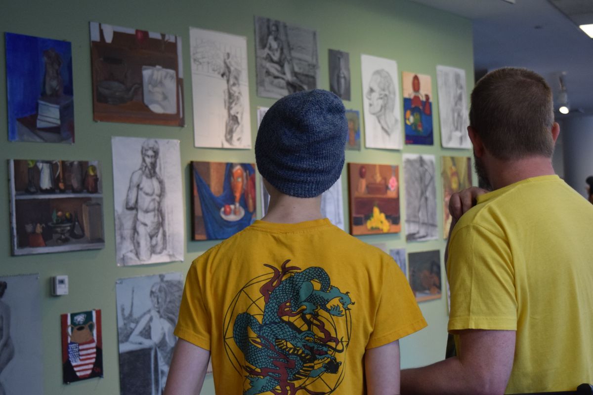 Student and teacher viewing an exhibit.