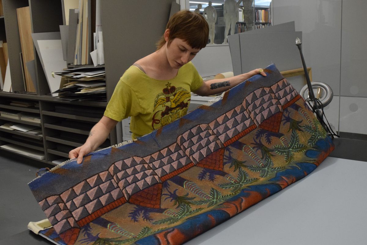 Jessica Willittes works to conserve her piece "39 Victories..."