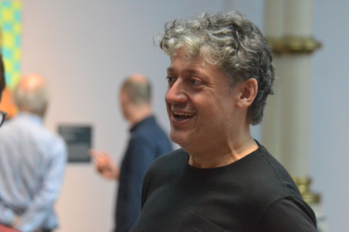 Artist Nestor Armando Gil at the opening reception of SWARM.