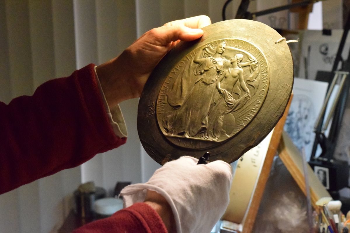 Phebe Hemphill holds a work in two hands