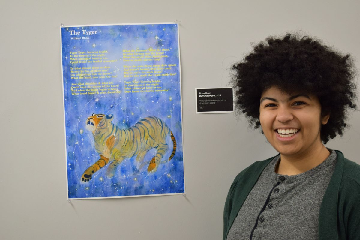 Brice Hunt stands in front of her work.