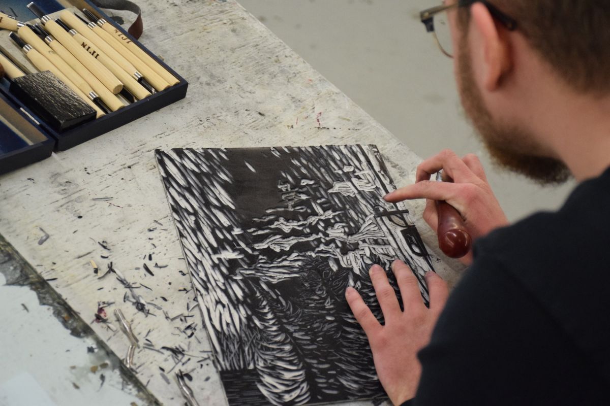 Nat Bombeke '22 at work in the Print Shop.