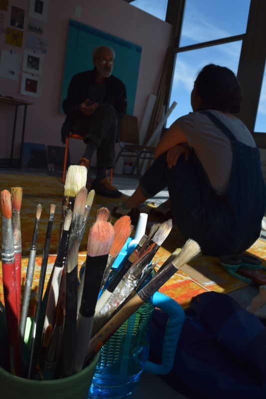 Stuart Shils discusses work with a PAFA student in the studio.
