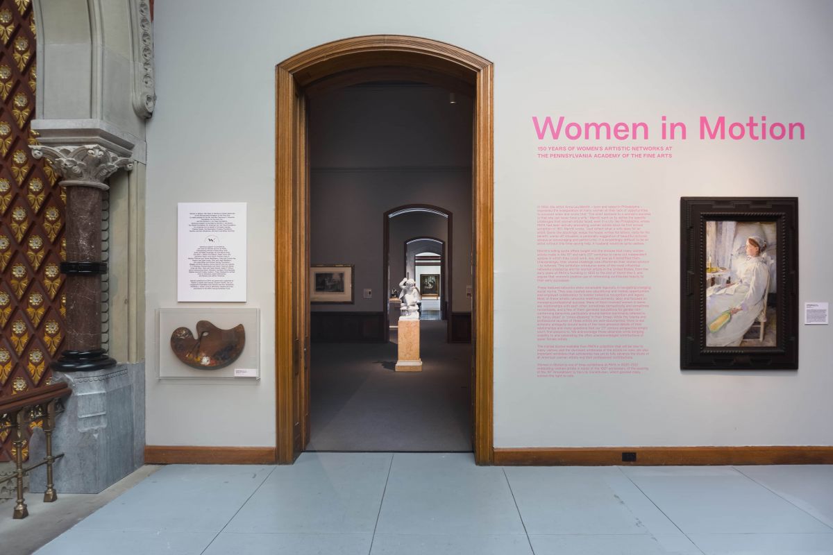 Gallery wall with intro to Women in Motion exhibition