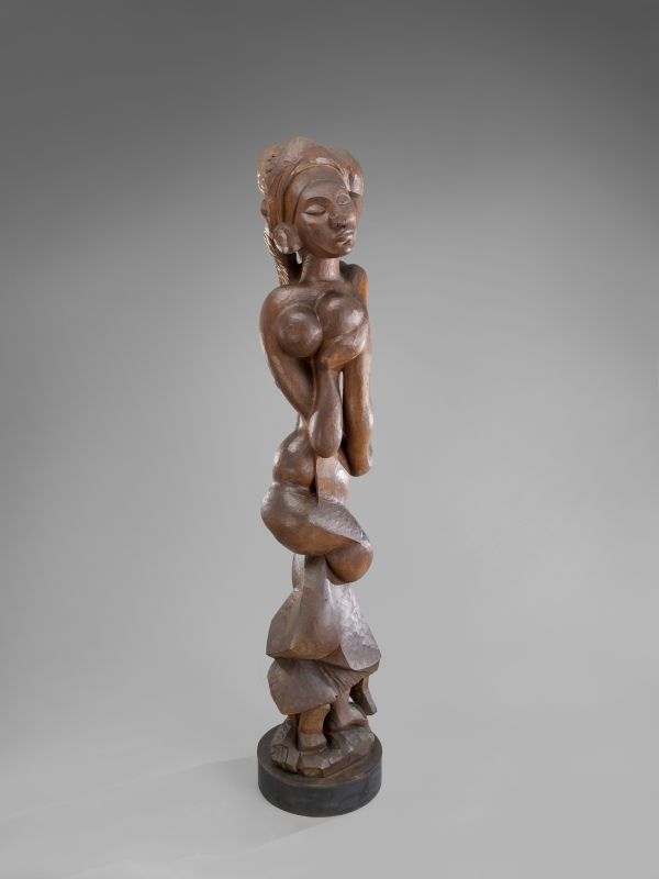 Wooden sculpture of a human figure. 