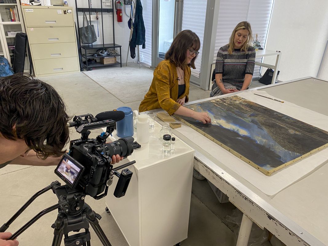 Videographer filming conservator and curator Ali Printz