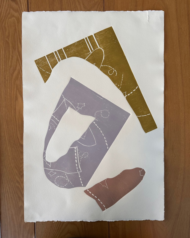 an abstract print featuring cut-out shapes in muted earth tones