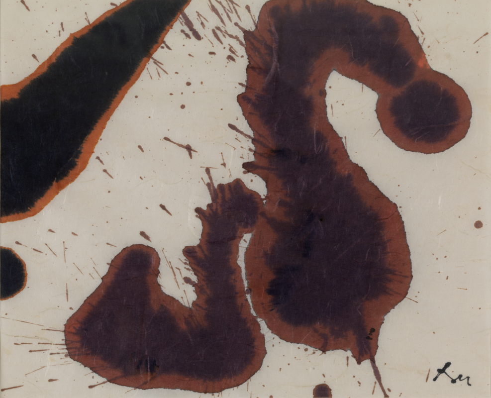 An abstract ink drawing on rice paper featuring fluid, organic shapes in dark brown and black with soft orange bleeding around the edges, accented by spontaneous splatters and the handwritten initials "RM" in the bottom right corner.