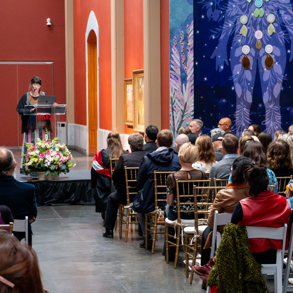 graduation ceremony looking towards speaker at podium