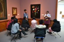 student docents in the museum