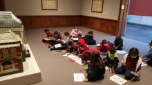 children during art art activity in museum gallery