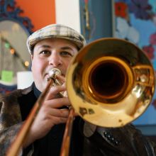 portrait of Dan Blacksberg with his trombone