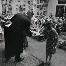 black and white photo of a student receiving an award