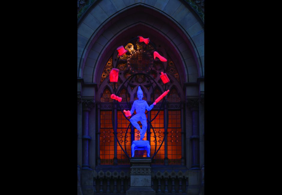<em>The Young Punch Juggling</em>, by Robert Taplin, on the Historic Landmark Building plinth