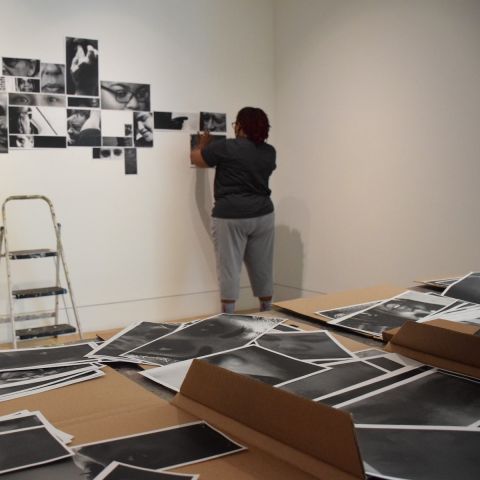 Lyn Townes (MFA '19) installs work in the School of Fine Arts gallery.