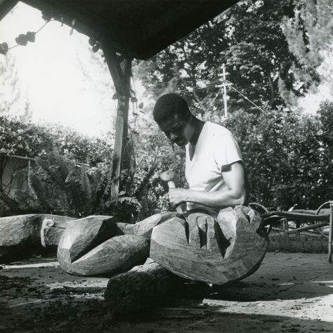 John Rhoden carving a sculpture