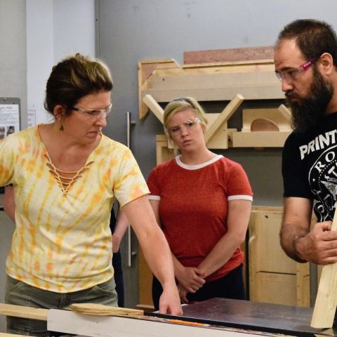 John Greig with others working.