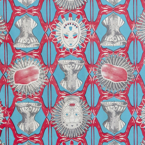 A vibrant repeating textile pattern in red, cyan, and off-white shows interlocking geometric motifs with stylized human faces featuring red lips and spiky halo-like hair, gray corset- or armor-like forms, and circular sunburst shapes with pink, organic-looking centers.